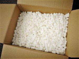 Packing cardboard box filled with packing peanuts