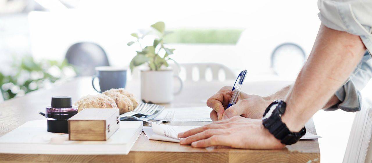 man filling out paperwork